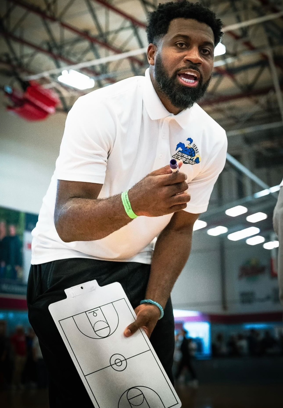 Coach Justin Dentmon on the court